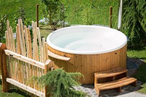A hot tub in a yard