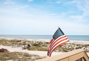 an American flag on a beach