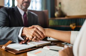 Two persons shaking hands