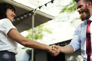 two persons shaking hands